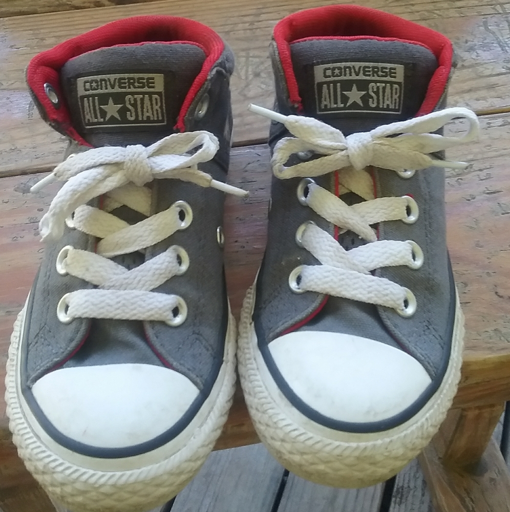 Children Converse All Star high top sneakers.